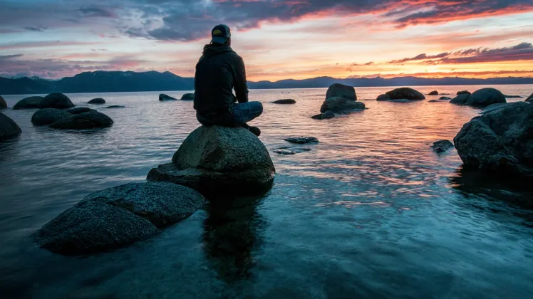 man sitting in peace