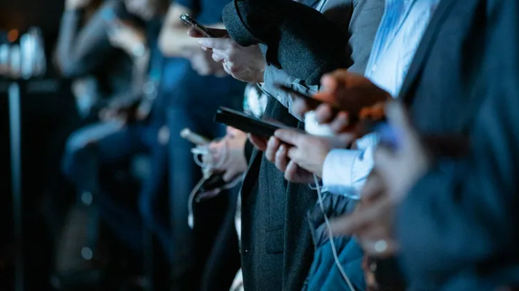 people staring at their smartphones