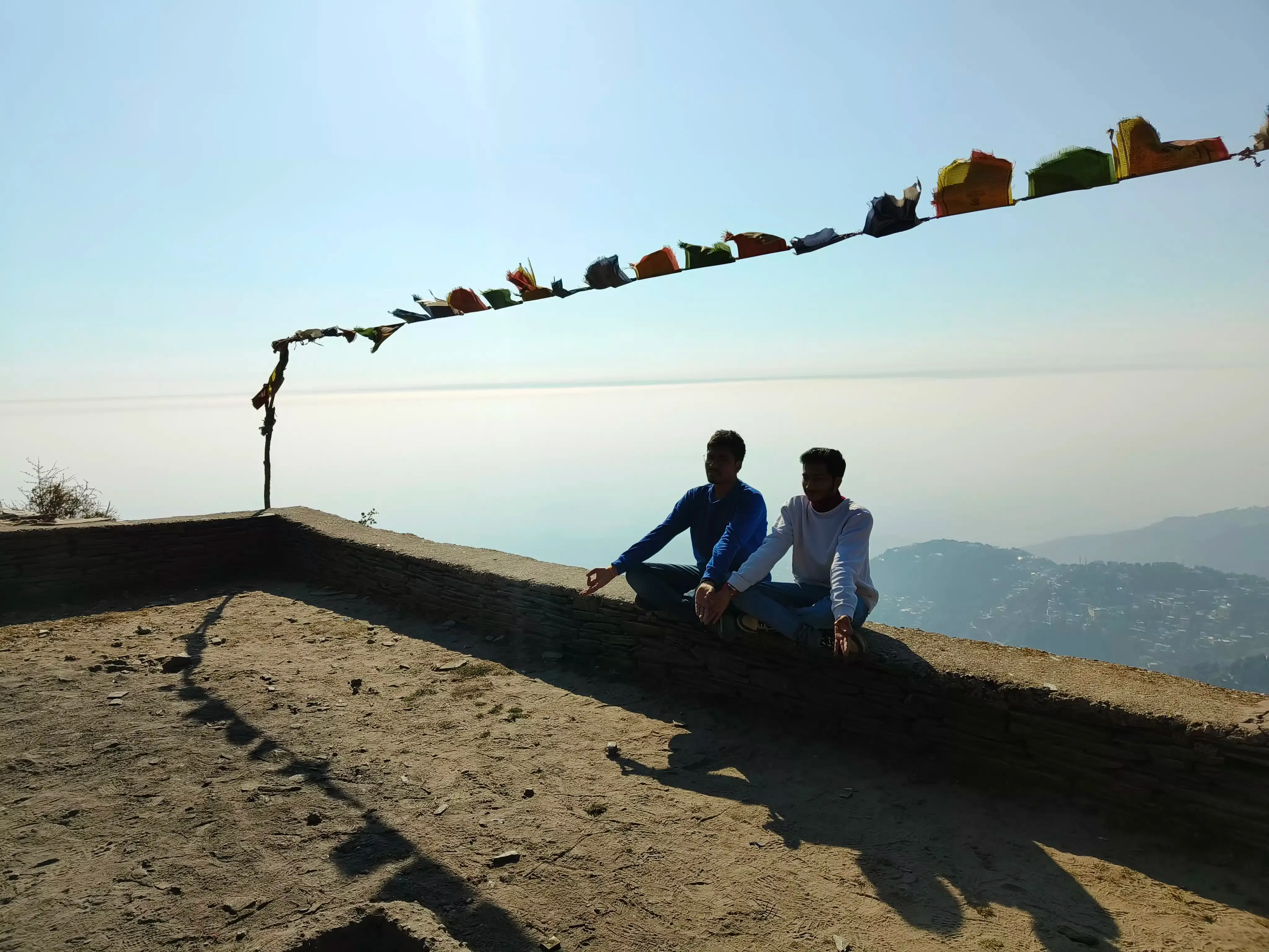 boys meditating on mountain